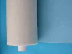 A roll of white nylon screen printing mesh with white paper core