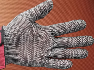 A stainless steel five-finger style chainmail glove with pink flexible wrist strap.
